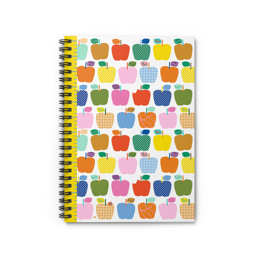 Notebook with colorful apple pattern on a white background